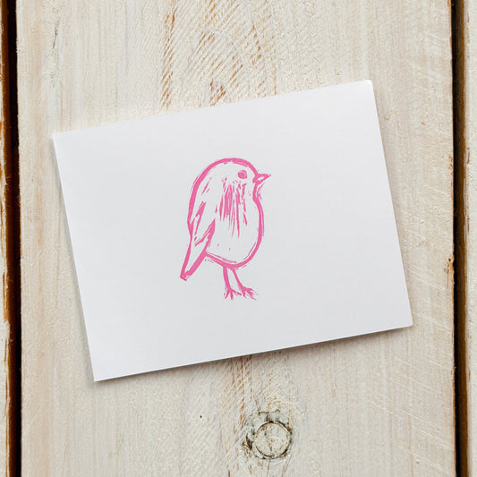 White card with a pink bird stamp on paper